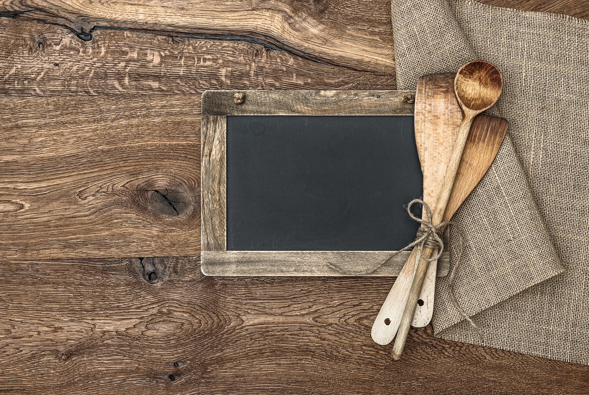 Wooden table with arranged tasting menu